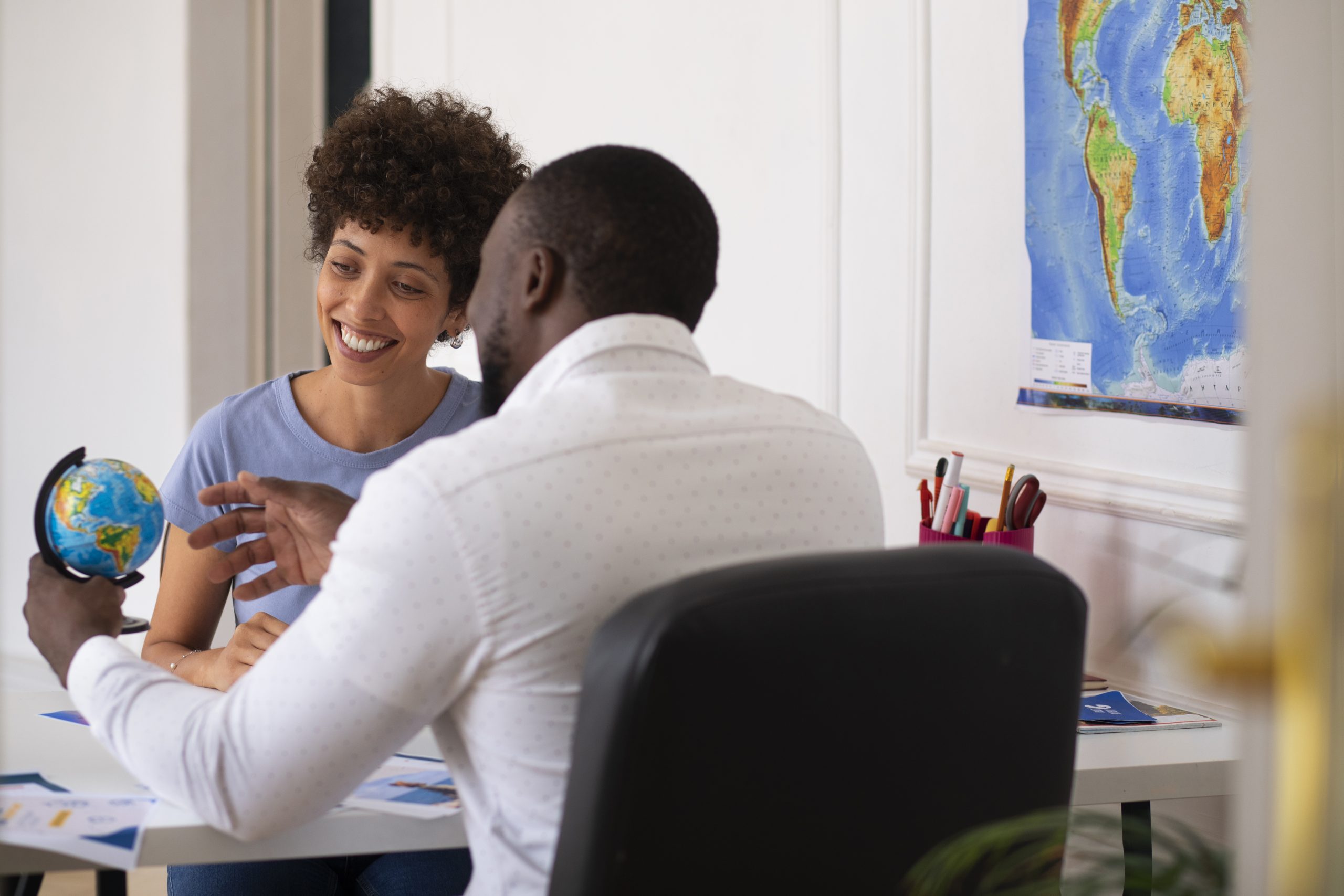 medium shot people travel agency office scaled